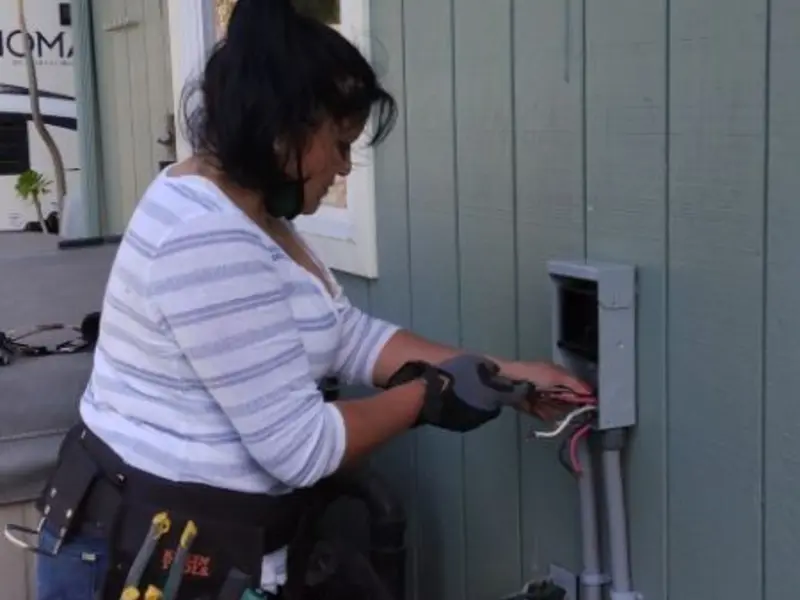 Licensed electrician wiring an exterior subpanel in Lake Shastina